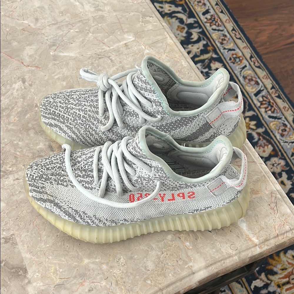 Gray and White Sneakers with Red Accents